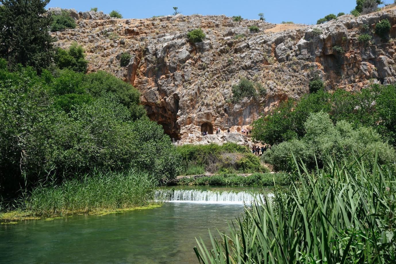 A spring and waterfall at the foot of the cliff and cave of Caesarea Philippi